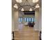 Open-concept living room with hardwood floors, exposed beams, and abundant natural light at 25219 S 194Th St, Queen Creek, AZ 85142