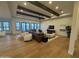 Large living area featuring hardwood floors, ample seating, and entertainment center at 25219 S 194Th St, Queen Creek, AZ 85142