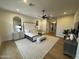 Serene main bedroom with neutral tones, a decorative ceiling fan, bedside tables, and a cozy bench at 25219 S 194Th St, Queen Creek, AZ 85142