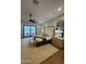 Relaxing main bedroom featuring neutral decor, bench, ceiling fan, with sliding glass doors to the outside at 25219 S 194Th St, Queen Creek, AZ 85142
