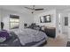 Bright bedroom with king-size bed and en-suite bathroom at 3714 S 58 Dr, Phoenix, AZ 85043