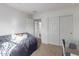 Bedroom with daybed, closet and access to bathroom at 3714 S 58 Dr, Phoenix, AZ 85043