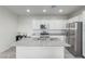 Modern kitchen with stainless steel appliances and island at 3714 S 58 Dr, Phoenix, AZ 85043