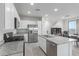 Modern kitchen with stainless steel appliances and island at 3714 S 58 Dr, Phoenix, AZ 85043