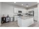 Modern kitchen with white cabinets and granite countertops at 3714 S 58 Dr, Phoenix, AZ 85043