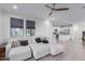 Open living space with a sectional sofa and kitchen view at 3714 S 58 Dr, Phoenix, AZ 85043