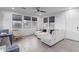 Bright living room, featuring a sectional sofa and large windows at 3714 S 58 Dr, Phoenix, AZ 85043