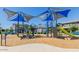 Modern playground with shade structures and climbing wall at 3714 S 58 Dr, Phoenix, AZ 85043