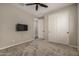 Bright bedroom featuring a ceiling fan and ample closet space at 7534 W Jones Ave, Phoenix, AZ 85043