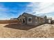 New home with covered patio and block wall at 17862 W Blue Sky Dr, Surprise, AZ 85387