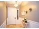 Inviting foyer with travertine floors, white wainscoting, and stylish decor at 2116 N 81St Cir, Mesa, AZ 85207