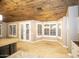 Bright kitchen featuring custom cabinets, stainless appliances, stone accents, and a large island with seating at 2116 N 81St Cir, Mesa, AZ 85207