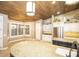 Bright kitchen featuring custom cabinets, stainless appliances, stone accents, and a large island with seating at 2116 N 81St Cir, Mesa, AZ 85207