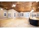Open concept kitchen and dining area featuring a wood plank ceiling and a large island at 2116 N 81St Cir, Mesa, AZ 85207