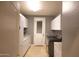 Laundry room with cabinets, granite countertops, and modern washer and dryer at 2116 N 81St Cir, Mesa, AZ 85207
