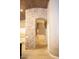 Open-concept living space with stone accents, a wood plank ceiling, and travertine flooring at 2116 N 81St Cir, Mesa, AZ 85207