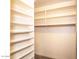 Walk-in closet with custom shelving at 2116 N 81St Cir, Mesa, AZ 85207