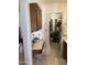 Bathroom featuring vanity area, cabinets and view into walk-in closet at 402 W Grandview Rd, Phoenix, AZ 85023
