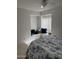 Bright bedroom featuring a cozy window nook with built-in bench and storage at 402 W Grandview Rd, Phoenix, AZ 85023