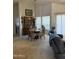Bright dining area with a chandelier, comfortable seating for four, and sliding glass doors leading to the patio at 402 W Grandview Rd, Phoenix, AZ 85023