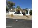 Inviting single-story home featuring a two-car garage, desert landscaping, and a freshly painted exterior at 402 W Grandview Rd, Phoenix, AZ 85023