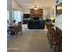 Spacious living room with a brick fireplace, a dining area, and comfortable seating at 402 W Grandview Rd, Phoenix, AZ 85023