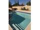 Clear blue swimming pool featuring stairs and a geometric tile border, perfect for relaxation at 402 W Grandview Rd, Phoenix, AZ 85023
