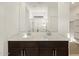 Bathroom featuring a double vanity, spacious shower, and a walk-in closet at 16039 W Desert Hollow Dr, Surprise, AZ 85379