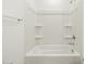 Full bathroom with a shower-tub combination and white walls at 16039 W Desert Hollow Dr, Surprise, AZ 85379