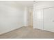 Spacious bedroom with carpet flooring, closet, and a bright interior at 16039 W Desert Hollow Dr, Surprise, AZ 85379