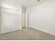 Bedroom with a large closet, carpet flooring, and a bright interior at 16039 W Desert Hollow Dr, Surprise, AZ 85379