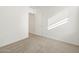 Bright bedroom featuring carpet floors and a closet at 16039 W Desert Hollow Dr, Surprise, AZ 85379