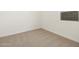 Clean bedroom features neutral carpet and a small window at 16039 W Desert Hollow Dr, Surprise, AZ 85379