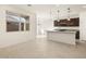 Open concept kitchen featuring granite counters, stainless steel appliances, and a kitchen island with pendant lighting at 16039 W Desert Hollow Dr, Surprise, AZ 85379