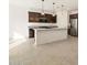 Spacious open kitchen with granite countertops, stainless steel appliances, and a center island at 16039 W Desert Hollow Dr, Surprise, AZ 85379