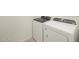 Bright laundry room features a newer washer and dryer set at 16039 W Desert Hollow Dr, Surprise, AZ 85379