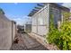 View of a covered patio with a lattice cover in a low maintenance desert landscaped backyard at 11275 N 99Th Ave # 145, Peoria, AZ 85345