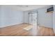 Spacious bedroom with wood floors, light blue walls, and sliding glass door to the patio at 11275 N 99Th Ave # 145, Peoria, AZ 85345