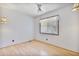 Bedroom with laminate floors, white walls, ceiling fan, and light-blocking shades over the window at 11275 N 99Th Ave # 145, Peoria, AZ 85345