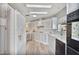 Bright and spacious kitchen with white cabinets, backsplash, and modern appliances at 11275 N 99Th Ave # 145, Peoria, AZ 85345