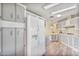 Spacious kitchen with white cabinets, stone backsplash and functional layout at 11275 N 99Th Ave # 145, Peoria, AZ 85345