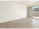 Dining room with sliding glass doors and modern chandelier at 16037 W Desert Hollow Dr, Surprise, AZ 85387