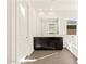 Bright bathroom showcases a double vanity, tub, and door at 22455 W Pontiac Dr, Surprise, AZ 85387