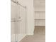 Bathroom featuring a tiled shower with glass door, and a closet at 22455 W Pontiac Dr, Surprise, AZ 85387