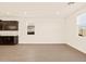 Modern kitchen with dark cabinets, granite countertops, and an open layout offering a stylish and functional space at 22455 W Pontiac Dr, Surprise, AZ 85387