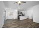 Spacious living room with recessed lighting, ceiling fan, and open concept kitchen at 24592 W St Anne Ave, Buckeye, AZ 85326