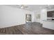 Bright living room with backyard access, ceiling fan, and modern flooring at 24592 W St Anne Ave, Buckeye, AZ 85326