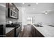 Close up of the kitchen, featuring stainless steel appliances, granite countertops and a kitchen island with a sink at 24593 W St Catherine Ave, Buckeye, AZ 85326