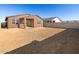 Large backyard with unlandscaped area and block wall at 17323 W Sanna St, Waddell, AZ 85355