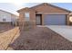 Single story home with neutral exterior, gray door, and blue garage door at 17323 W Sanna St, Waddell, AZ 85355